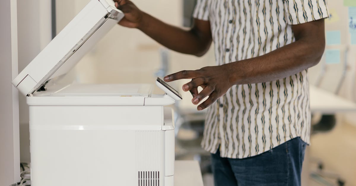 A document scanner in an office, the kind of device that produces the flat scanned PDFs this guide turns into fillable forms.